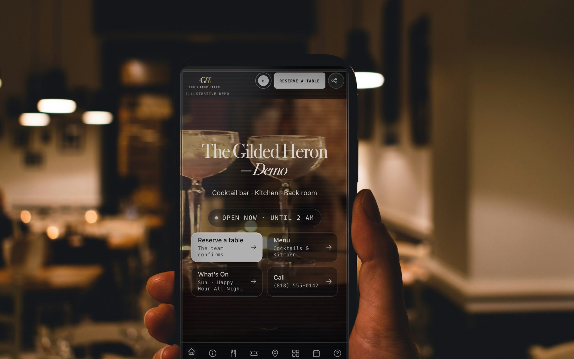 The Gilded Heron mobile Showcase in a guest's hand